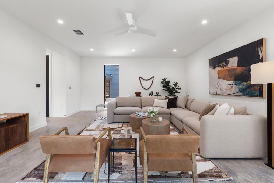 The thoughtfully designed living room offers plenty of space for everyday comfort. The thoughtfully designed living room offers plenty of space for everyday comfort.