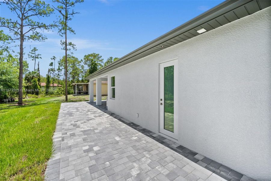 Front exterior of a new home in , Naples, FL, highlighting curb appeal (Image 24).