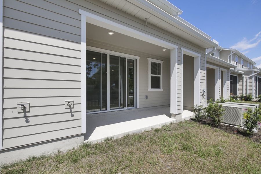 Exterior details and patio area of a home in Towns at Riverwalk, Sanford (Image 2). Exterior details and patio area of a home in Towns at Riverwalk, Sanford (Image 2).