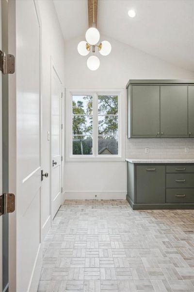 Spacious upstairs Utility Room with high ceilings, designer lighting & cabinetry, work sink, and storage closet! Spacious upstairs Utility Room with high ceilings, designer lighting & cabinetry, work sink, and storage closet!