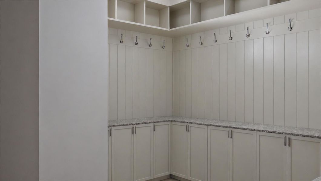 The mud room/drop zone offers a great space to store backpacks, shoes, and sports equipment as you enter the home. The mud room/drop zone offers a great space to store backpacks, shoes, and sports equipment as you enter the home.