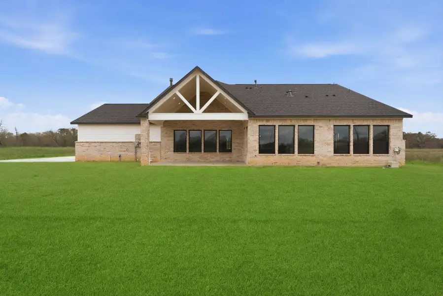 Exterior details and patio area of a home in High Meadow Estates, New Waverly (Image 3).