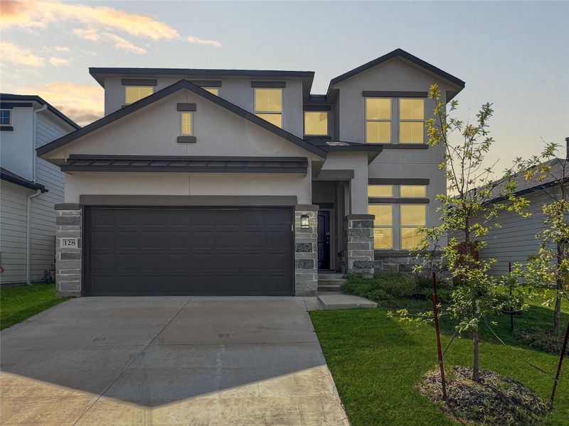 Front exterior of a new home in Morningstar, Andice, TX, highlighting curb appeal (Image 1).