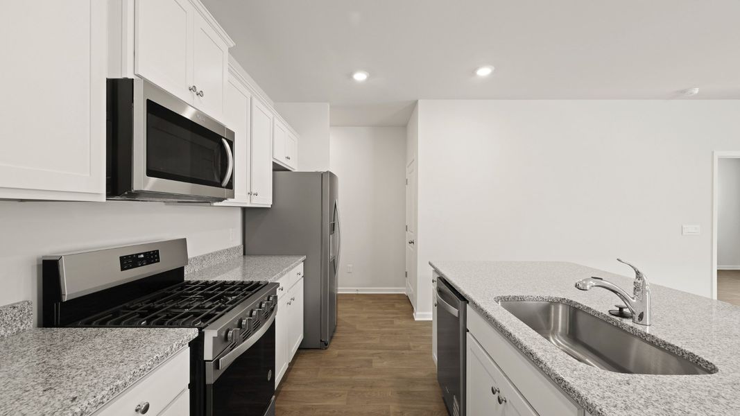 Furnished interior view inside a new home in Pine Hills at Cane Bay, Summerville (Image 6). Furnished interior view inside a new home in Pine Hills at Cane Bay, Summerville (Image 6).