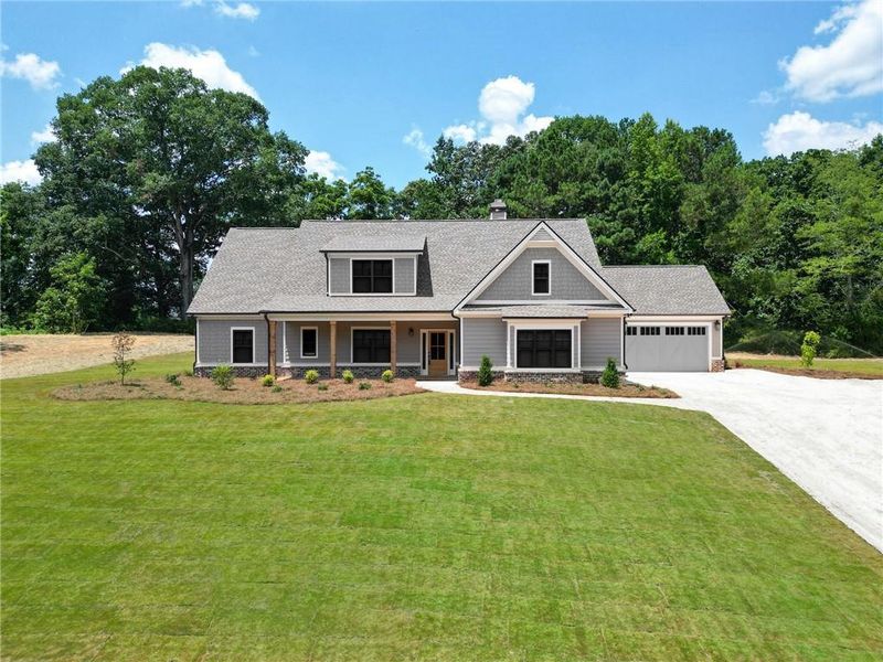 Front exterior of a new home in Nunnally Farm Rd, Monroe, GA, highlighting curb appeal (Image 1). Front exterior of a new home in Nunnally Farm Rd, Monroe, GA, highlighting curb appeal (Image 1).
