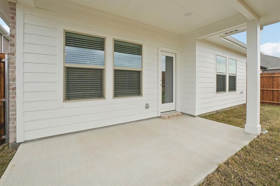 Exterior details and patio area of a home in Parks at Foster Crossing - Spring Series, Anna (Image 26).