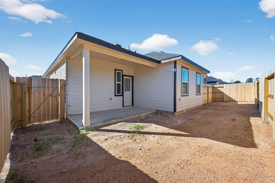 Exterior details and patio area of a home in Enclave at Willis, Willis (Image 21).
