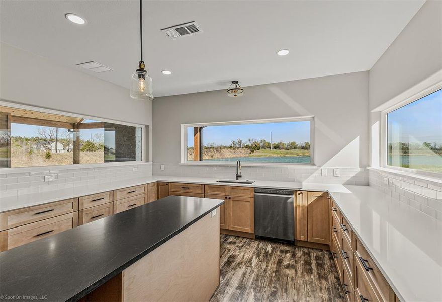 Dream kitchen with SO much custom cabinetry, pot filler with electric range.  However, this kitchen is ALL about the views!