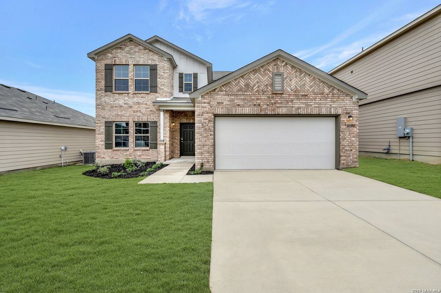 Front exterior of a new home in Vista Gardens, San Antonio, TX, highlighting curb appeal (Image 1). Front exterior of a new home in Vista Gardens, San Antonio, TX, highlighting curb appeal (Image 1).