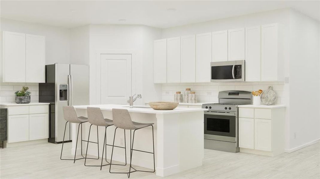 Kitchen with decorative backsplash, stainless steel appliances, a breakfast bar area, and an island with sink Kitchen with decorative backsplash, stainless steel appliances, a breakfast bar area, and an island with sink