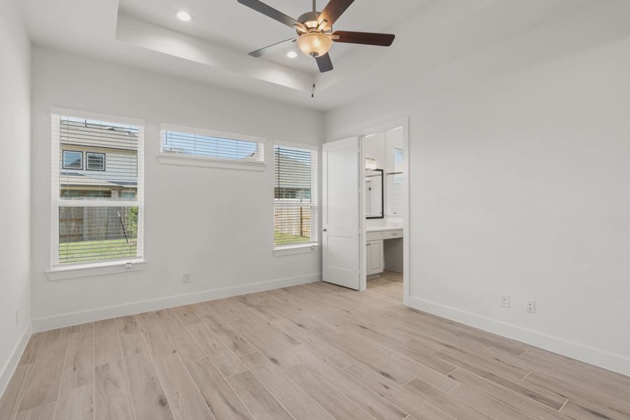Representative unfurnished interior of a home built from the Macalister by Chesmar Homes in Artavia, Conroe (Image 11).