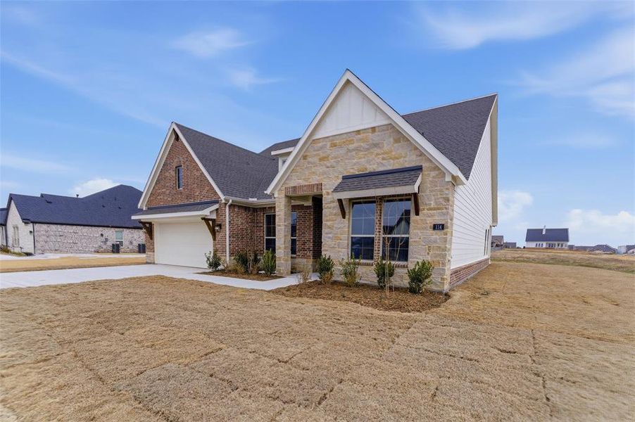 Front exterior of a new home in Fairview Meadows, New Fairview, TX, highlighting curb appeal (Image 17).
