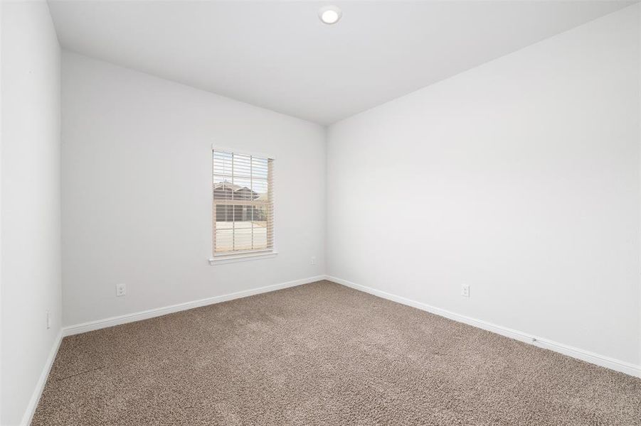 Spare room featuring carpet floors