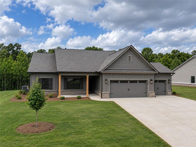 Front exterior of a new home in Weslyn Park, Social Circle, GA, highlighting curb appeal (Image 22).