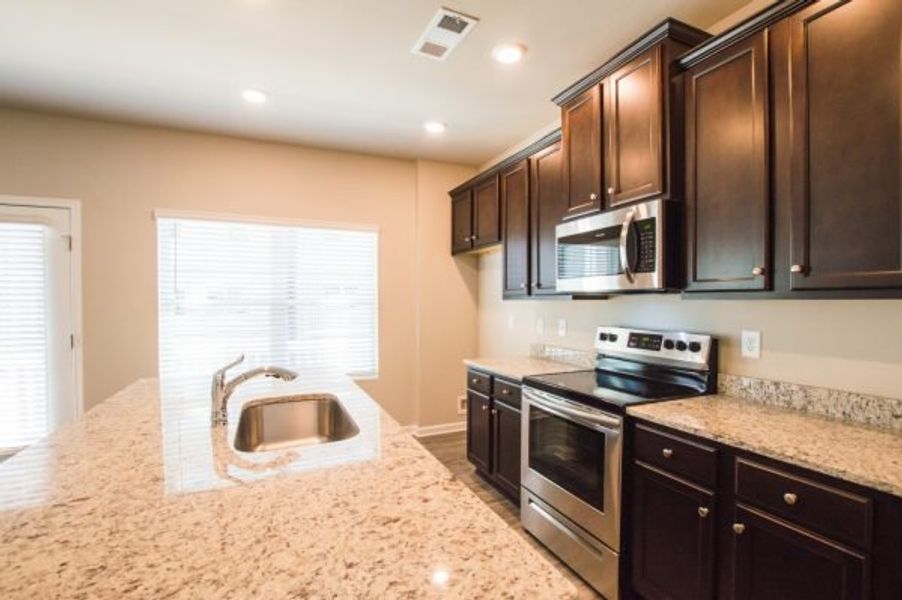 Representative furnished interior of a home built from the Cadence Unit B by Piedmont Residential in Ross Pointe, Kennesaw (Image 8).