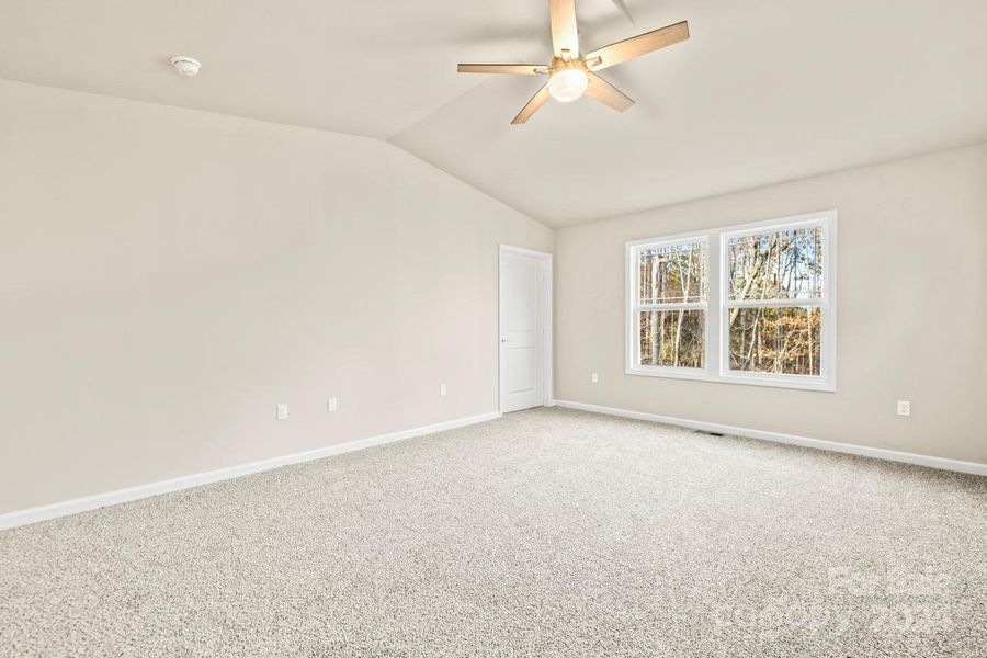 The primary bedroom captures the views