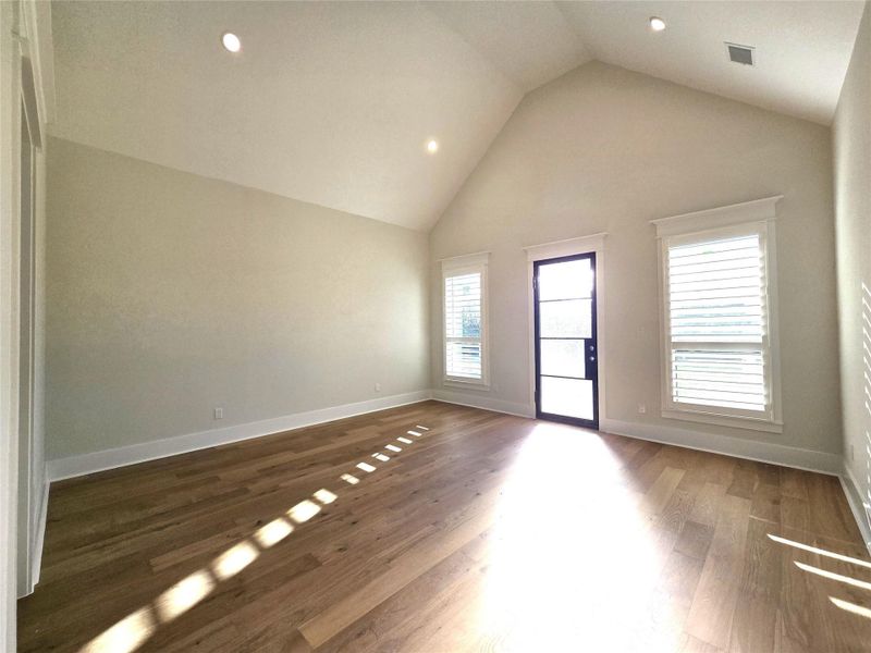 Primary Bedroom with door leading to private patio area