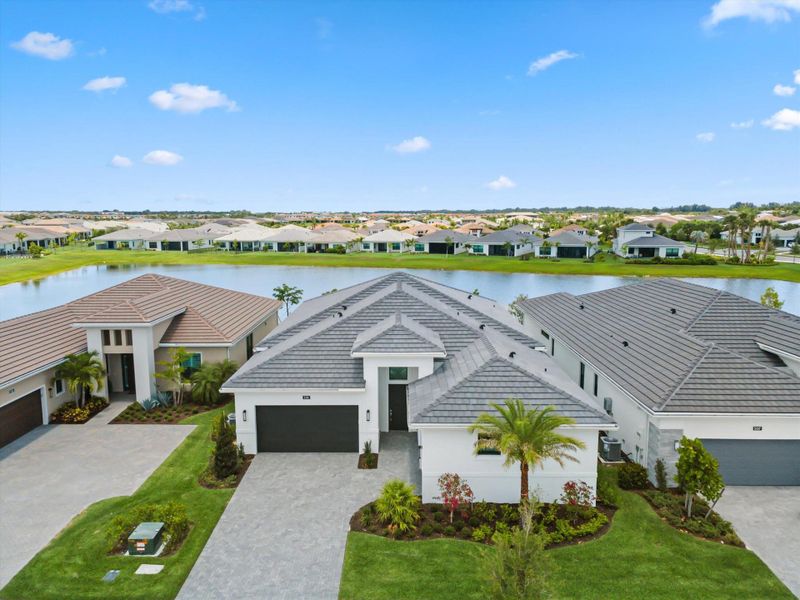 Front exterior of a new home in Cresswind Palm Beach at Westlake, Westlake, FL, highlighting curb appeal (Image 27). Front exterior of a new home in Cresswind Palm Beach at Westlake, Westlake, FL, highlighting curb appeal (Image 27).
