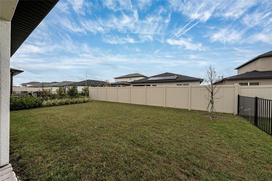 Exterior details and patio area of a home in Havenfield at Crossprairie, St. Cloud (Image 4).