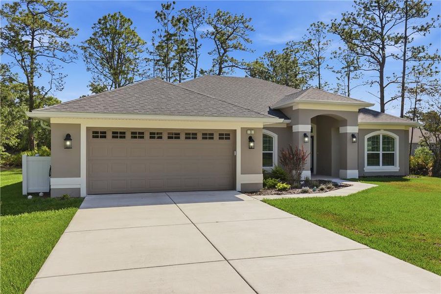 Front exterior of a new home in , Homosassa, FL, highlighting curb appeal (Image 1). Front exterior of a new home in , Homosassa, FL, highlighting curb appeal (Image 1).