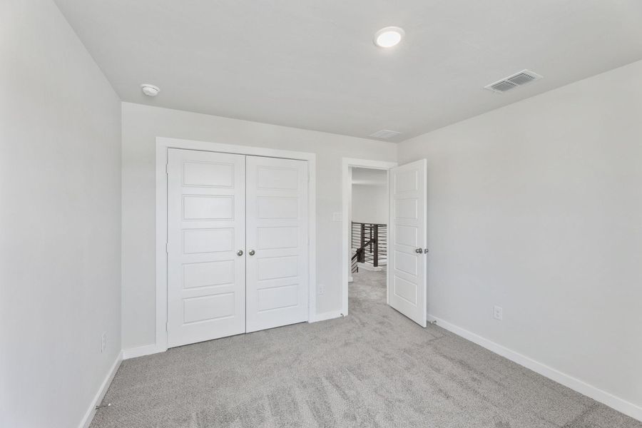 Representative unfurnished interior of a home built from the Alto by Hakes Brothers in The Woodlands, Mico (Image 12).