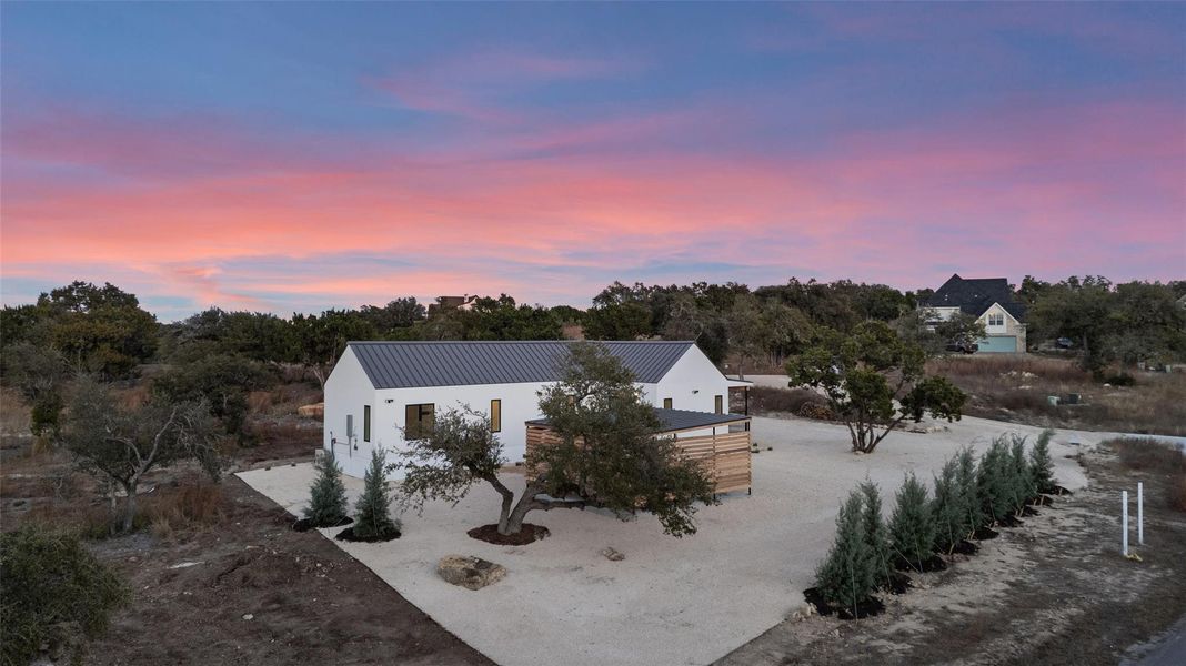 Front exterior of a new home in , Wimberley, TX, highlighting curb appeal (Image 2).