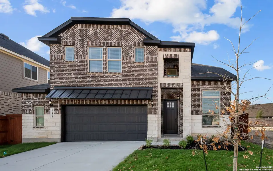 Front exterior of a new home in Stillwater Ranch, San Antonio, TX, highlighting curb appeal (Image 21).