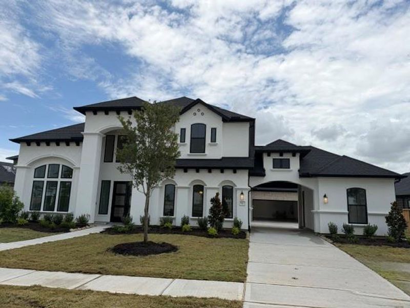 Front exterior of a new home in Dunham Pointe, Cypress, TX, highlighting curb appeal (Image 20). Front exterior of a new home in Dunham Pointe, Cypress, TX, highlighting curb appeal (Image 20).