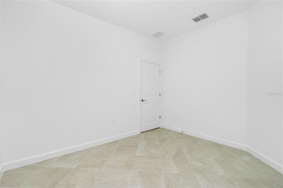 Spacious, unfurnished interior of a new home in Island Lakes at Coco Bay: Villas, Englewood (Image 21).