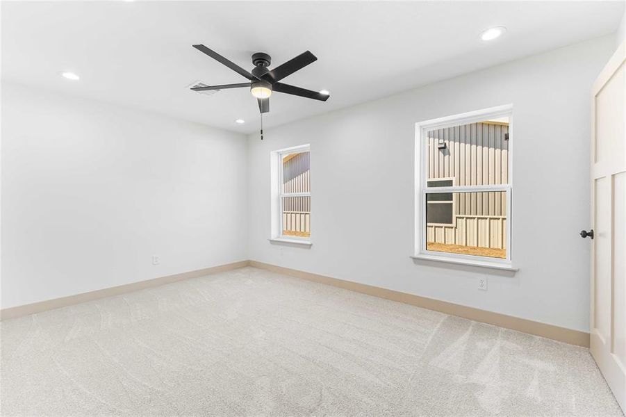 Unfurnished room featuring light carpet, recessed lighting, and ceiling fan Unfurnished room featuring light carpet, recessed lighting, and ceiling fan