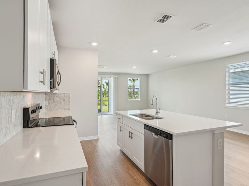 Furnished interior view inside a new home in Crescent Lakes - Premier Series, Punta Gorda (Image 6).