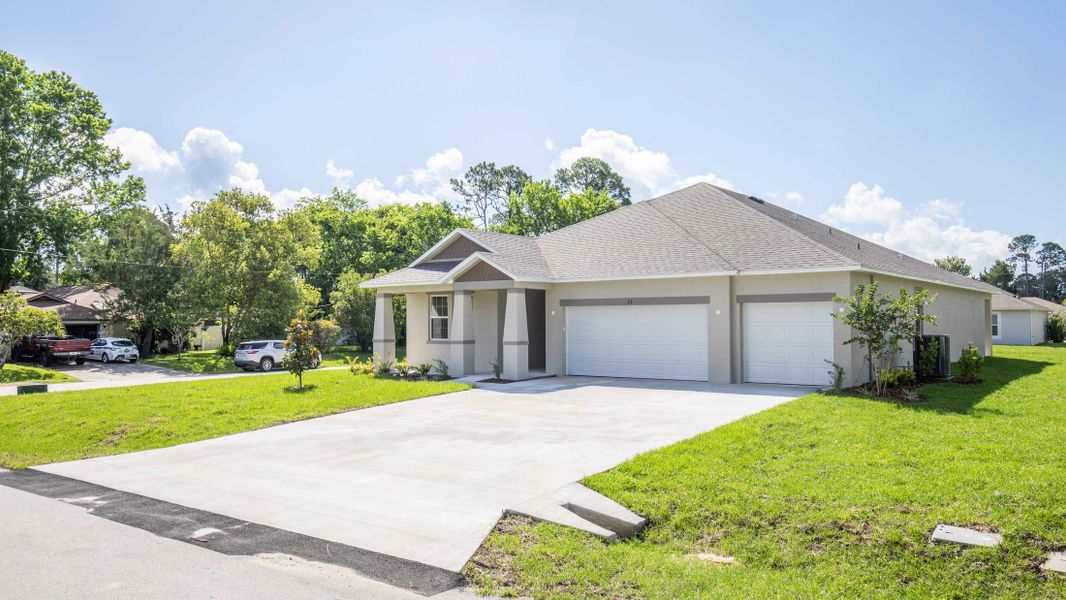 Front exterior of a new home in Sugarmill Woods, Homosassa, FL, highlighting curb appeal (Image 18).