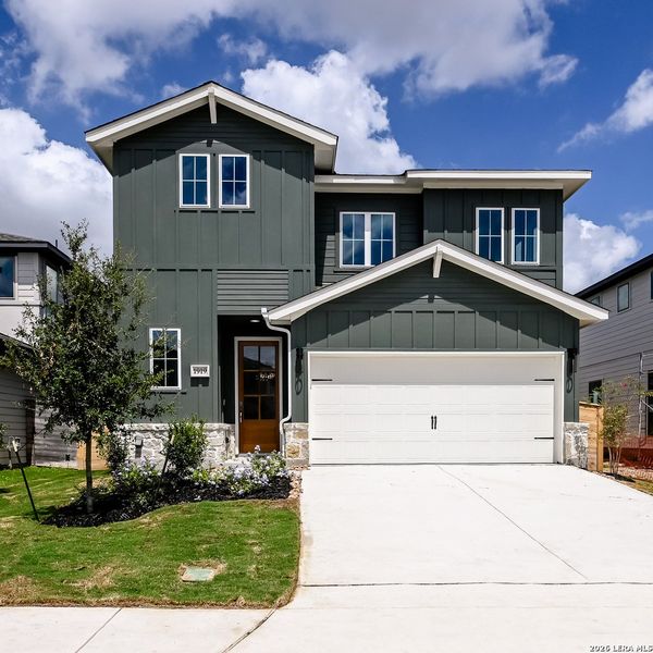 Front exterior of a new home in Solms Landing, New Braunfels, TX, highlighting curb appeal (Image 1). Front exterior of a new home in Solms Landing, New Braunfels, TX, highlighting curb appeal (Image 1).