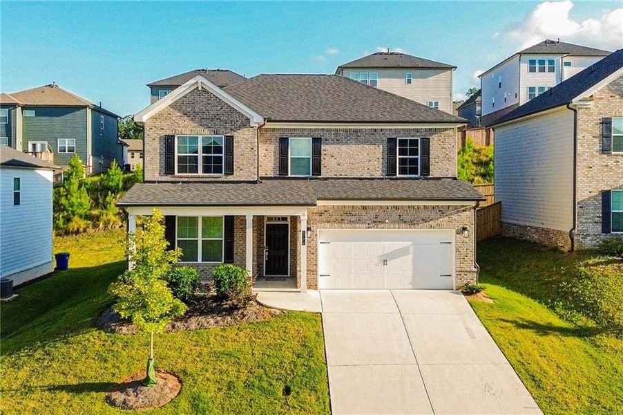 Front exterior of a new home in , South Fulton, GA, highlighting curb appeal (Image 22). Front exterior of a new home in , South Fulton, GA, highlighting curb appeal (Image 22).