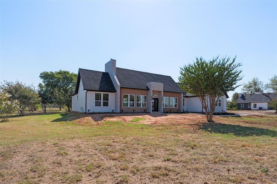 Front exterior of a new home in , Joshua, TX, highlighting curb appeal (Image 2).