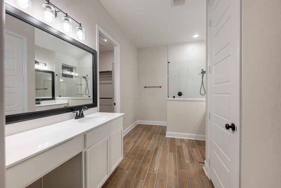 Representative furnished interior of a home built from the Mackenzie by Chesmar Homes in Sienna Lakes, San Antonio (Image 5).