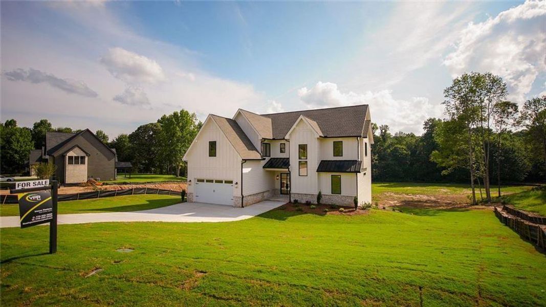 Front exterior of a new home in , Flowery Branch, GA, highlighting curb appeal (Image 30).
