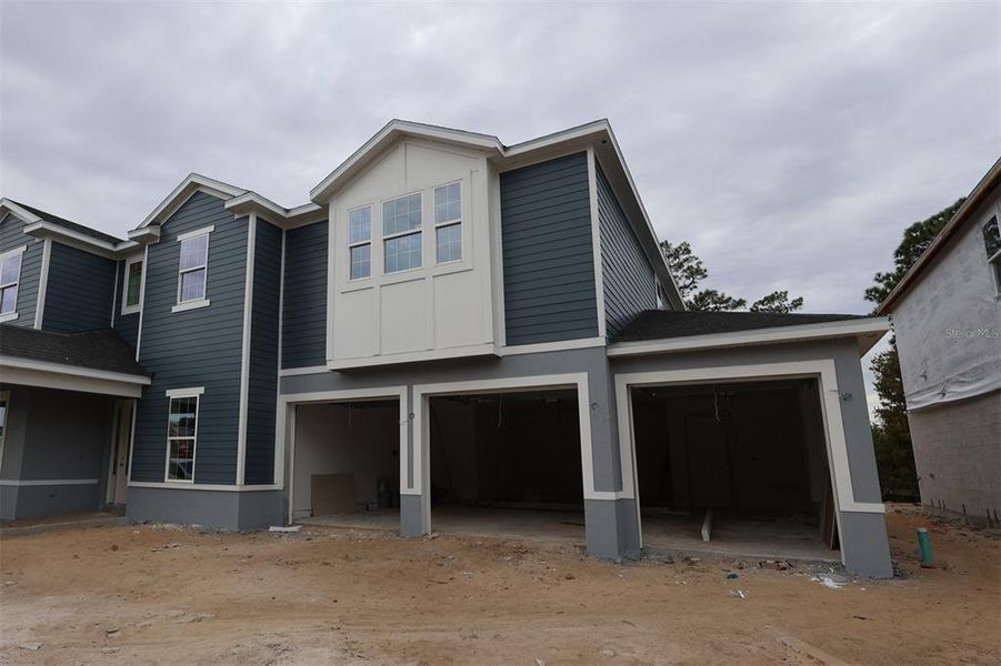 In-progress construction of a new home in Lake Star at Ovation, Winter Garden, FL (Image 21).