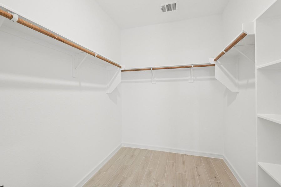 Primary suite walk-in closet Primary suite walk-in closet
