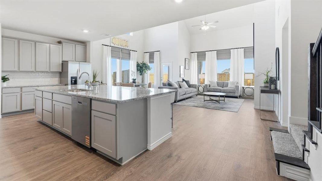 Open-concept living space featuring wood-finish flooring Open-concept living space featuring wood-finish flooring