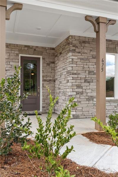 Exterior details and patio area of a home in Ashbury Commons, Powder Springs (Image 25).
