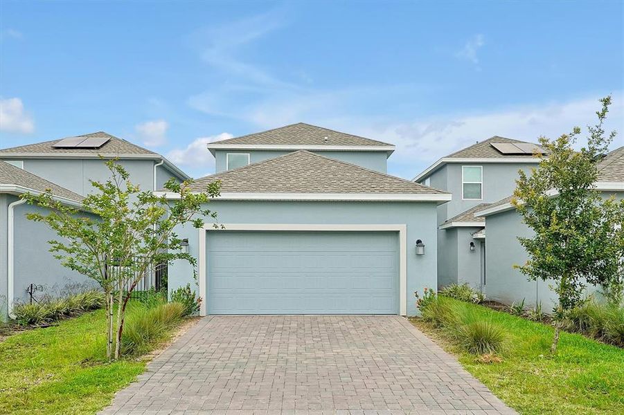 Front exterior of a new home in , Orlando, FL, highlighting curb appeal (Image 17).