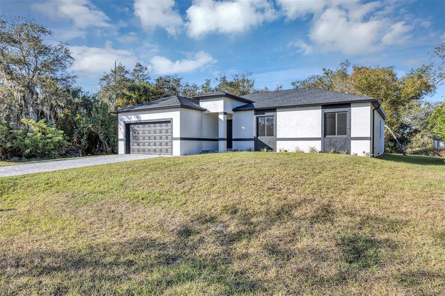 Front exterior of a new home in , Port Charlotte, FL, highlighting curb appeal (Image 28).