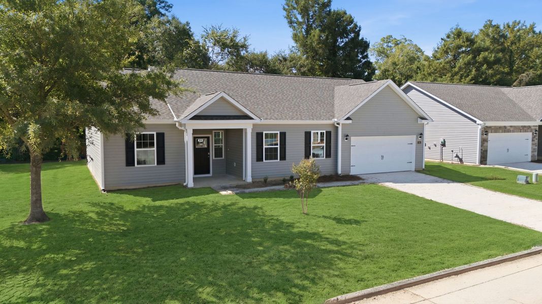 Front exterior of a new home in Tyler - Home on the Lake, New Bern, NC, highlighting curb appeal (Image 21).