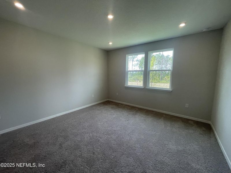 Spacious, unfurnished interior of a new home in Palm Series at Seminole Palms, Palm Coast (Image 31).