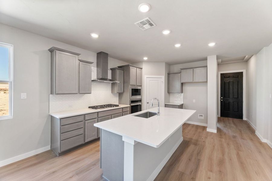 Furnished interior view inside a new home in Hunters Ranch, San Antonio (Image 6).
