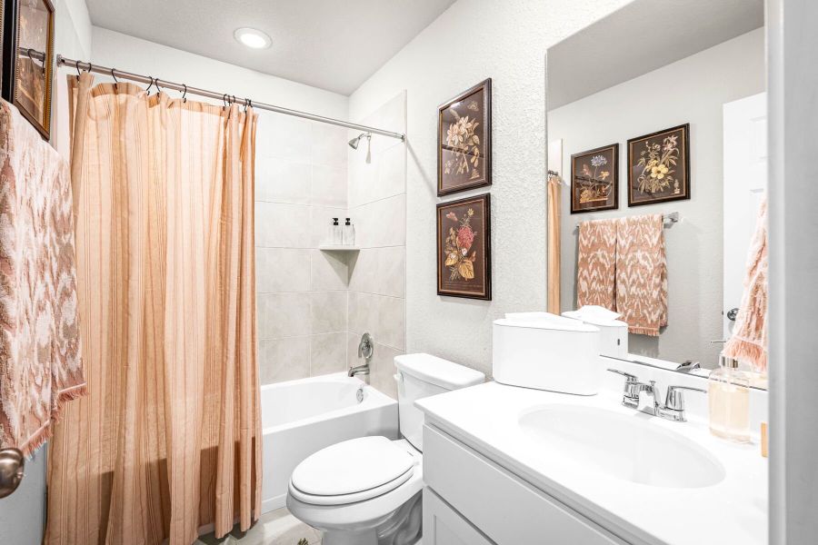 These are images of the secondary bathrooms in the Hawkins plan and is the model home in Carillon at 13305 Eppright Trace Blvd., Manor, TX. These are images of the secondary bathrooms in the Hawkins plan and is the model home in Carillon at 13305 Eppright Trace Blvd., Manor, TX.