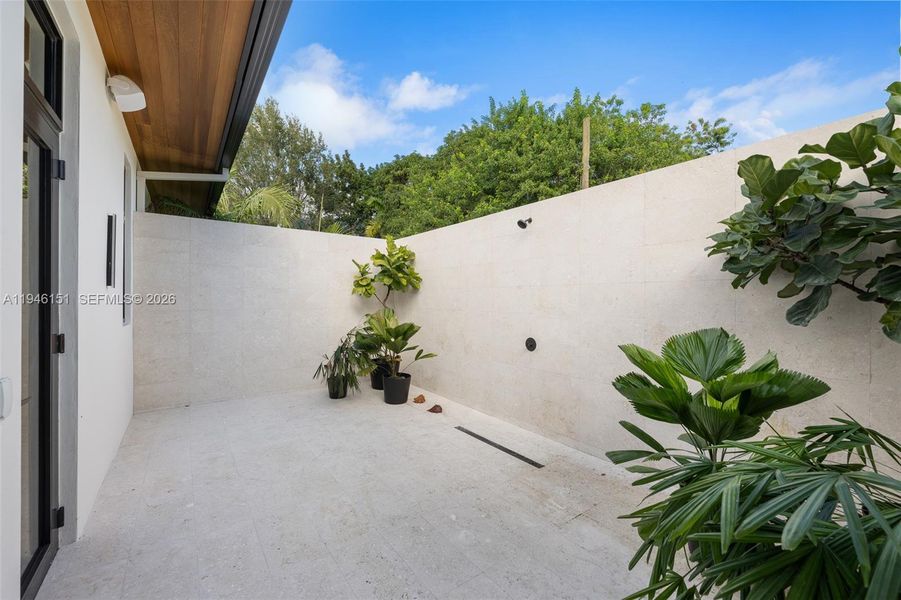 Exterior Shower & Tanning Area with Privacy Wall located in Primary Bedroom Exterior Shower & Tanning Area with Privacy Wall located in Primary Bedroom