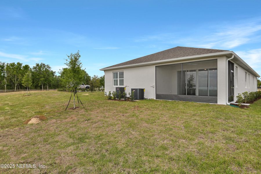 Front exterior of a new home in Seasons at Grandview Gardens, Deland, FL, highlighting curb appeal (Image 19).