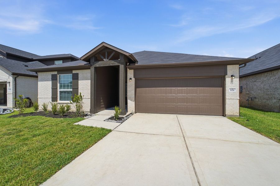 Front exterior of a new home in Pecan Estates, Crosby, TX, highlighting curb appeal (Image 2).